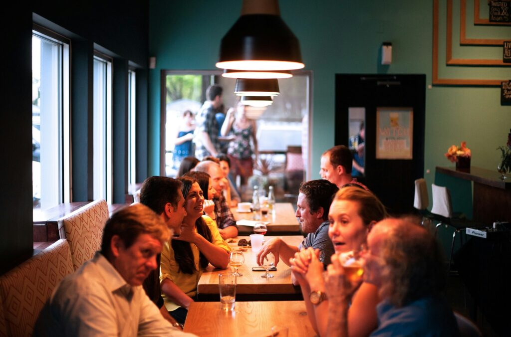 A group is seated at a restaurant socializing